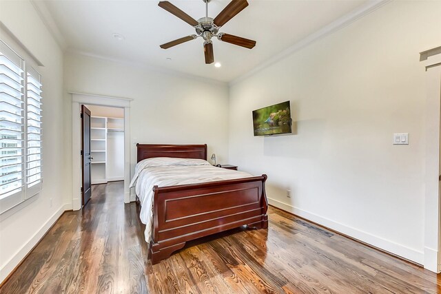 8305 Will Jordan Pkwy, Bellaire, TX 77401 - bedroom featuring crown molding, multiple windows, wood finished floors, baseboards, and recessed lighting