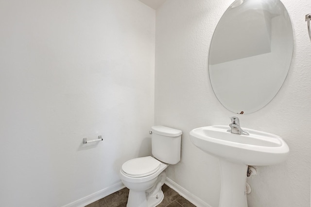 19311 Old Finch Ct, Houston, TX 77073 - half bathroom featuring toilet, baseboards, and tile patterned flooring