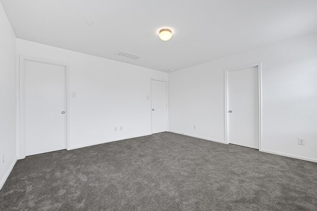 19311 Old Finch Ct, Houston, TX 77073 - empty room with dark colored carpet and baseboards