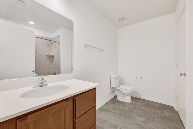 19311 Old Finch Ct, Houston, TX 77073 - bathroom with vanity, toilet, baseboards, and a tile shower