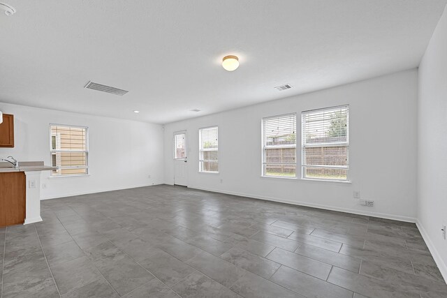 19311 Old Finch Ct, Houston, TX 77073 - unfurnished living room with baseboards
