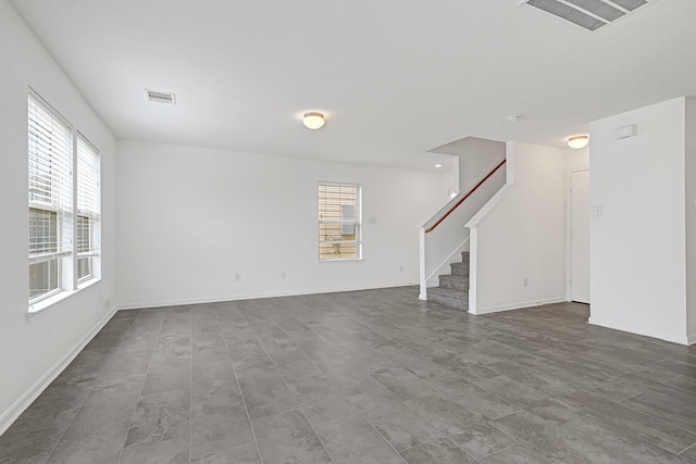 19311 Old Finch Ct, Houston, TX 77073 - unfurnished living room with plenty of natural light, stairway, and baseboards