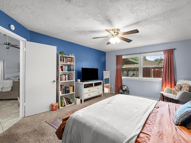 9731 Rocky Hollow Rd, La Porte, TX 77571 - tiled bedroom with a textured ceiling and ceiling fan