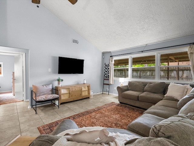 9731 Rocky Hollow Rd, La Porte, TX 77571 - living room with light tile patterned flooring, high vaulted ceiling, baseboards, and a ceiling fan