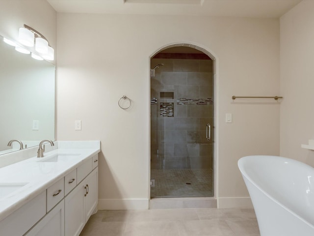 2301 Arabelle St, Houston, TX 77007 - full bathroom with double vanity, a stall shower, baseboards, and a soaking tub
