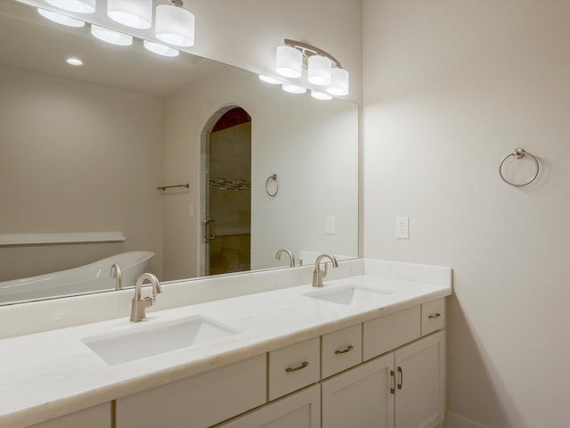 2301 Arabelle St, Houston, TX 77007 - bathroom featuring double vanity and recessed lighting