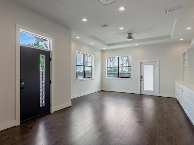 2301 Arabelle St, Houston, TX 77007 - entrance foyer featuring ceiling fan, a raised ceiling, dark wood-style flooring, recessed lighting, and baseboards