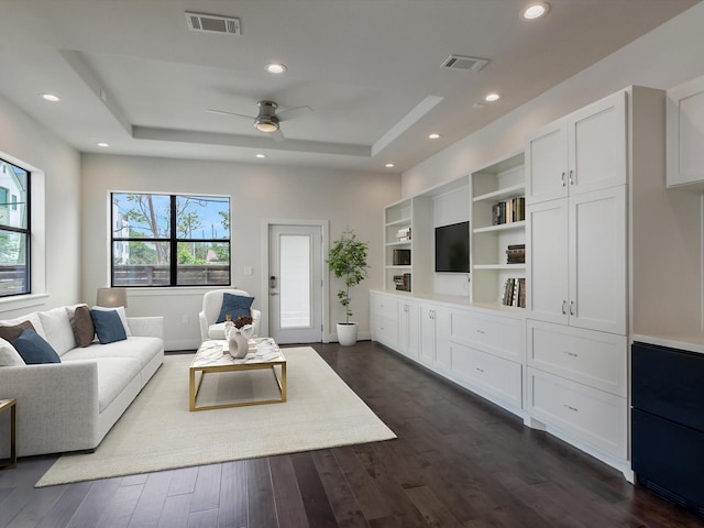 2301 Arabelle St, Houston, TX 77007 - living room featuring a tray ceiling, dark wood-style floors, a ceiling fan, and recessed lighting