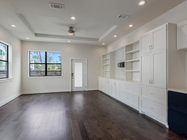 2301 Arabelle St, Houston, TX 77007 - unfurnished living room featuring a tray ceiling, ceiling fan, dark wood finished floors, baseboards, and recessed lighting