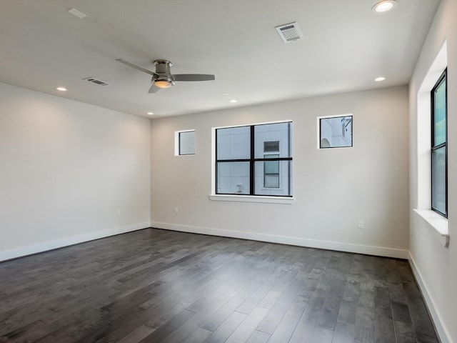 2301 Arabelle St, Houston, TX 77007 - empty room featuring healthy amount of natural light, a ceiling fan, dark wood-style floors, recessed lighting, and baseboards