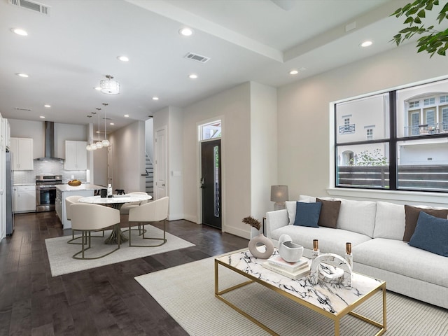 2301 Arabelle St, Houston, TX 77007 - living area with stairs, dark wood finished floors, recessed lighting, and baseboards
