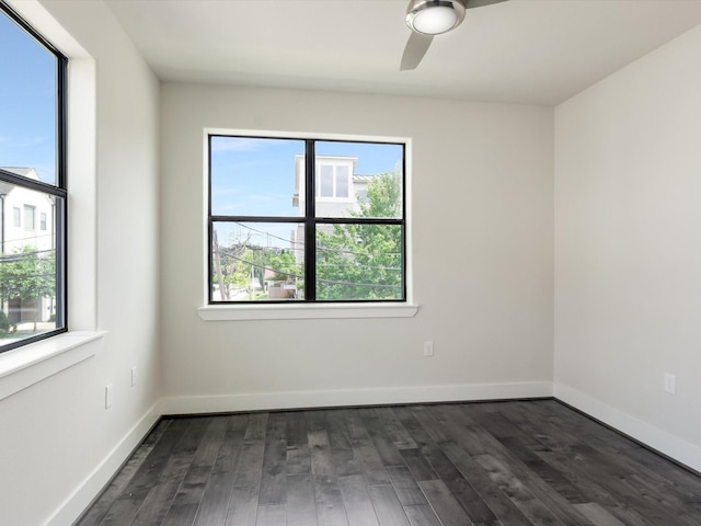 2301 Arabelle St, Houston, TX 77007 - spare room featuring healthy amount of natural light, dark wood finished floors, and a ceiling fan