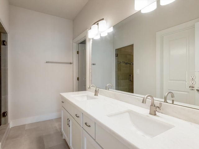 2301 Arabelle St, Houston, TX 77007 - bathroom featuring double vanity, a shower stall, and baseboards