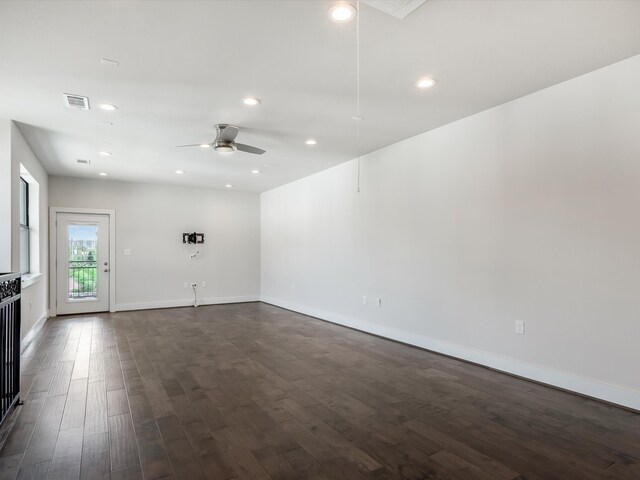 2301 Arabelle St, Houston, TX 77007 - unfurnished living room featuring a ceiling fan, dark wood-style floors, baseboards, and recessed lighting