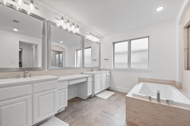 15603 Adobe Brick Ct, Cypress, TX 77433 - full bathroom featuring double vanity, a garden tub, and recessed lighting