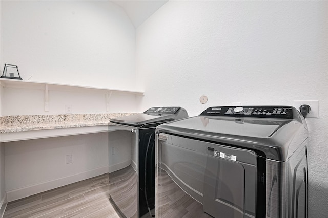 13811 Via Toluca Trl, Cypress, TX 77433 - laundry room with separate washer and dryer, light wood-style floors, and baseboards