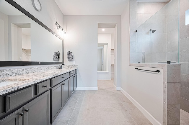 13811 Via Toluca Trl, Cypress, TX 77433 - full bath with double vanity, a walk in shower, and baseboards