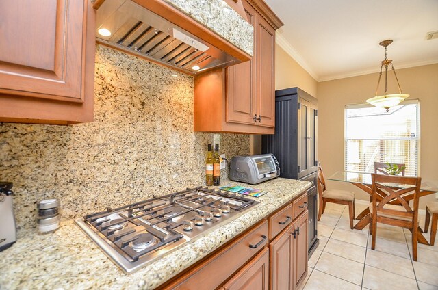 13023 Forester Canyon Ln, Sugar Land, TX 77498 - kitchen featuring custom exhaust hood, stainless steel gas cooktop, light tile patterned flooring, backsplash, and ornamental molding