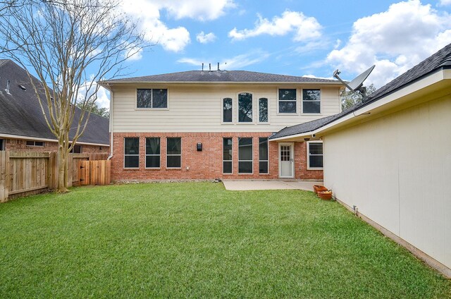 13023 Forester Canyon Ln, Sugar Land, TX 77498 - back of house featuring brick siding and a patio area