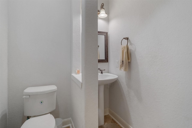 700 Southfield Dr, Friendswood, TX 77546 - bathroom with toilet and baseboards