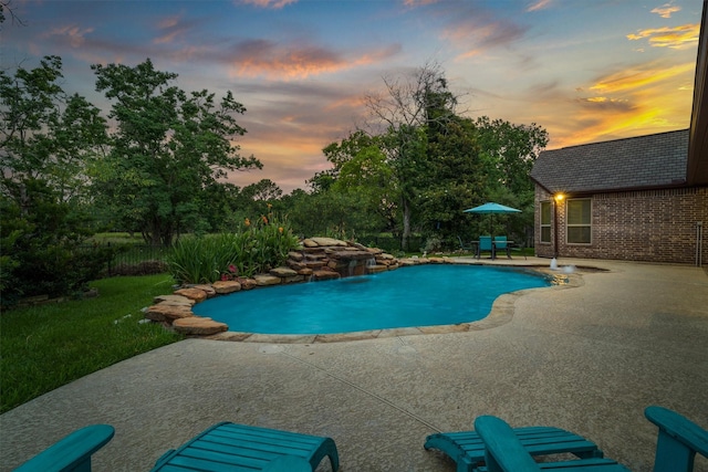 700 Southfield Dr, Friendswood, TX 77546 - pool at dusk featuring a patio area and an outdoor pool
