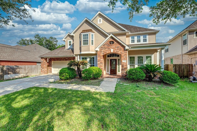 5923 Union Spgs, Sugar Land, TX 77479 - traditional-style house with stucco siding, driveway, an attached garage, and brick siding