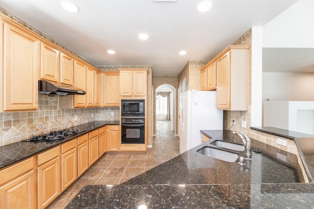 5923 Union Spgs, Sugar Land, TX 77479 - kitchen with black appliances, a sink, light brown cabinetry, under cabinet range hood, and recessed lighting