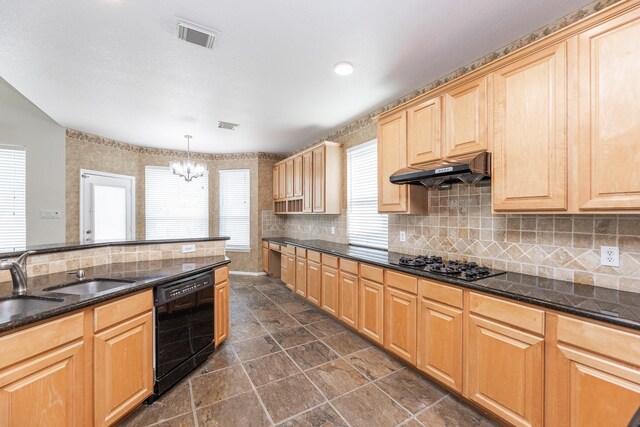 5923 Union Spgs, Sugar Land, TX 77479 - kitchen with black appliances, under cabinet range hood, a chandelier, a sink, and tasteful backsplash