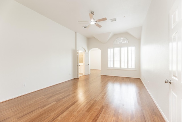 5923 Union Spgs, Sugar Land, TX 77479 - unfurnished room featuring ceiling fan, light wood-style floors, arched walkways, baseboards, and vaulted ceiling
