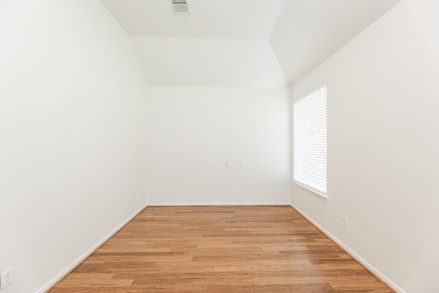 5923 Union Spgs, Sugar Land, TX 77479 - unfurnished room with light wood finished floors, vaulted ceiling, and baseboards