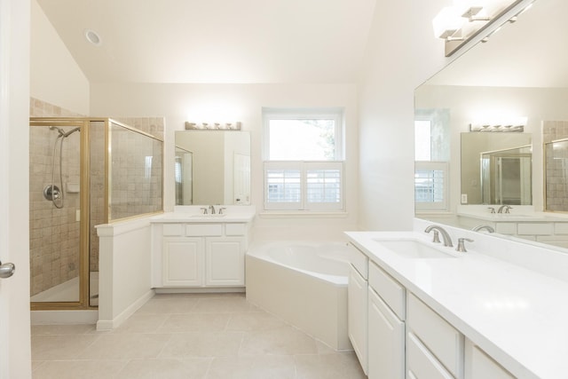 5923 Union Spgs, Sugar Land, TX 77479 - bathroom featuring tile patterned floors, a shower stall, a garden tub, and two vanities