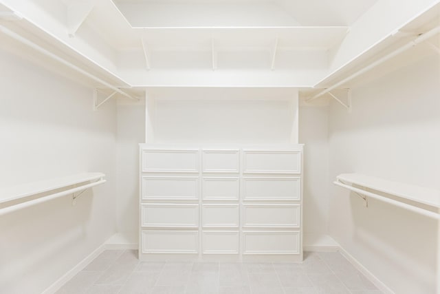 5923 Union Spgs, Sugar Land, TX 77479 - spacious closet featuring light tile patterned floors