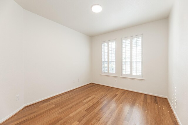 5923 Union Spgs, Sugar Land, TX 77479 - unfurnished room with light wood finished floors and baseboards
