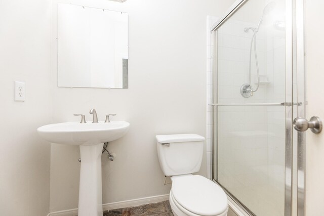 5923 Union Spgs, Sugar Land, TX 77479 - full bathroom featuring toilet, a stall shower, and baseboards