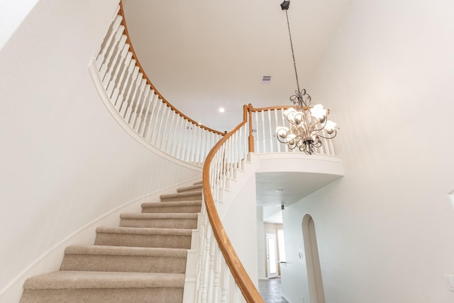 5923 Union Spgs, Sugar Land, TX 77479 - stairs featuring a towering ceiling, arched walkways, and a chandelier