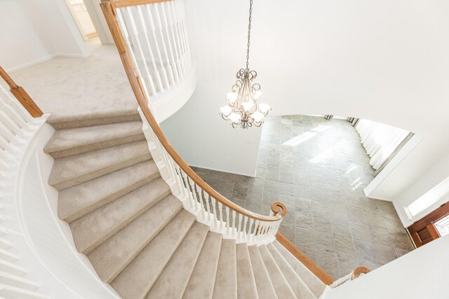 5923 Union Spgs, Sugar Land, TX 77479 - stairway featuring a chandelier