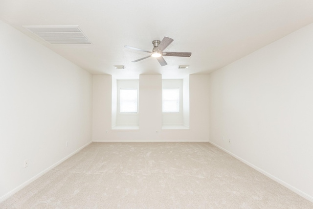 5923 Union Spgs, Sugar Land, TX 77479 - spare room featuring light colored carpet, ceiling fan, and baseboards
