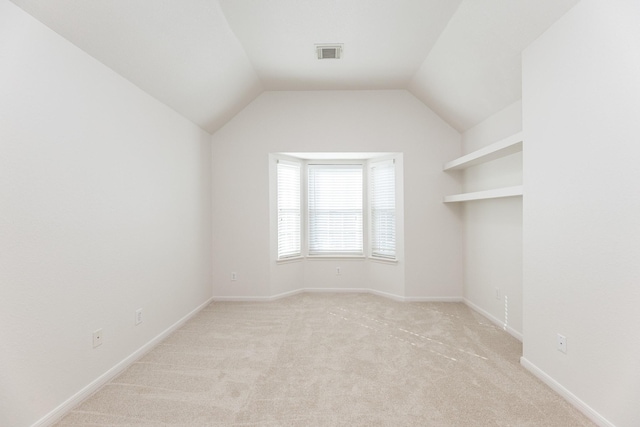 5923 Union Spgs, Sugar Land, TX 77479 - unfurnished room with light carpet, vaulted ceiling, and baseboards