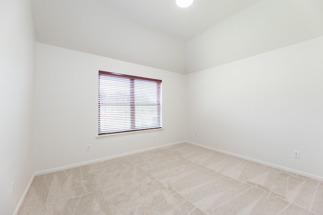 5923 Union Spgs, Sugar Land, TX 77479 - empty room with light colored carpet, baseboards, and vaulted ceiling