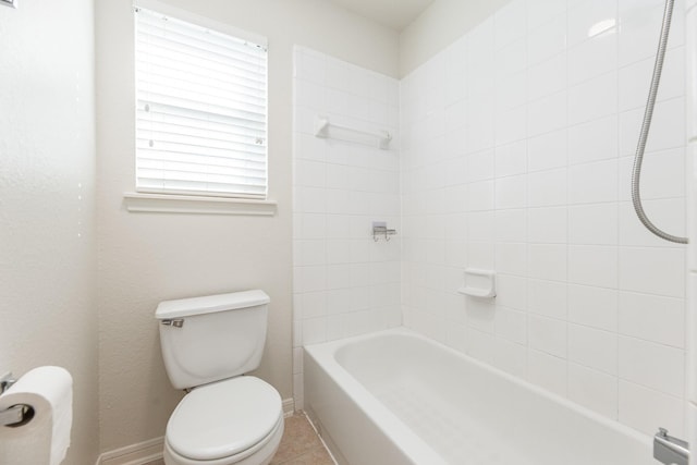 5923 Union Spgs, Sugar Land, TX 77479 - bathroom featuring toilet, washtub / shower combination, and baseboards