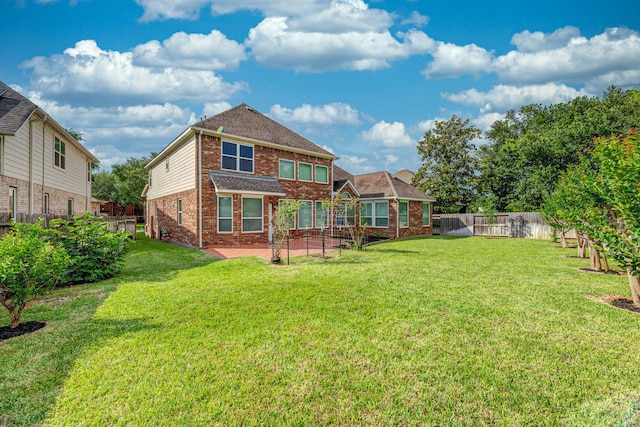 5923 Union Spgs, Sugar Land, TX 77479 - back of house featuring brick siding and a patio area