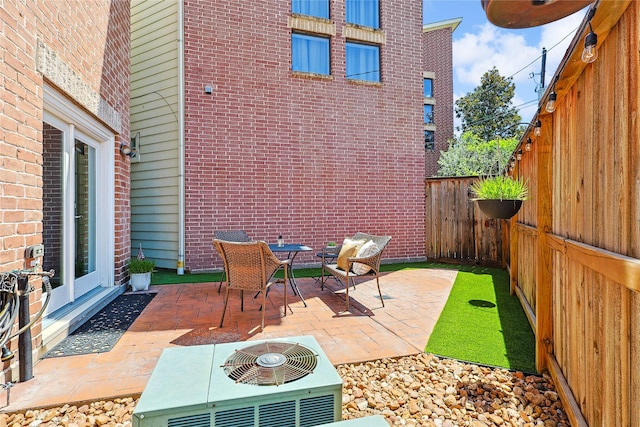 2505 Brinkman St, Houston, TX 77008 - fenced backyard featuring a patio, central AC, and outdoor dining area