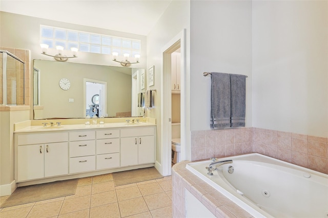 2505 Brinkman St, Houston, TX 77008 - full bathroom with toilet, a tub with jets, double vanity, tile patterned flooring, and a stall shower