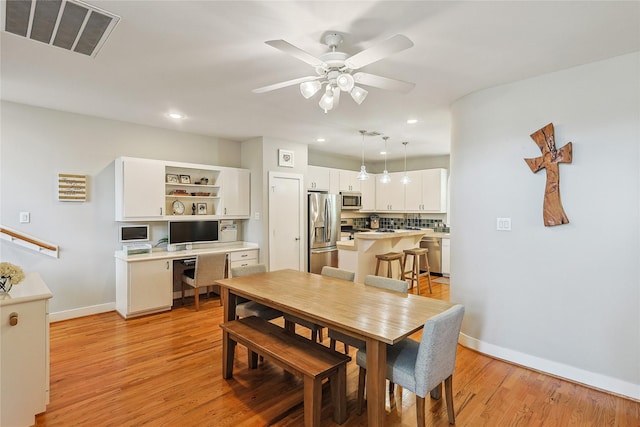 2505 Brinkman St, Houston, TX 77008 - dining room featuring recessed lighting, light wood-style floors, baseboards, a ceiling fan, and an office area