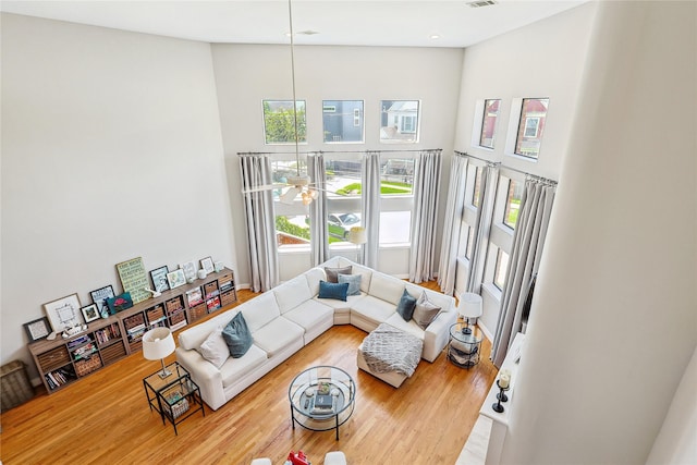 2505 Brinkman St, Houston, TX 77008 - living area with a high ceiling, wood finished floors, and recessed lighting