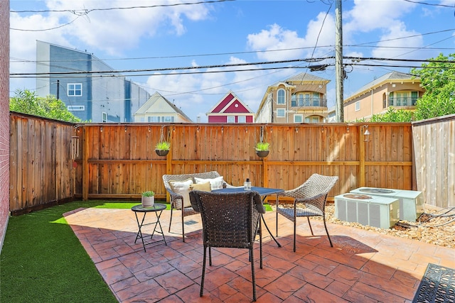 2505 Brinkman St, Houston, TX 77008 - fenced backyard featuring a patio area and central AC