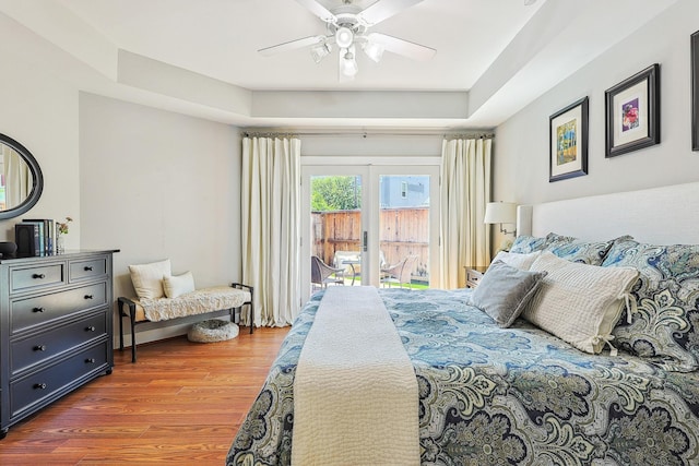2505 Brinkman St, Houston, TX 77008 - bedroom with access to outside, wood finished floors, ceiling fan, and a raised ceiling