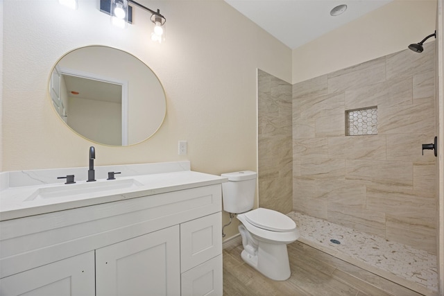 16960 W Dounreay, Montgomery, TX 77316 - bathroom featuring vanity, tiled shower, and wood finished floors