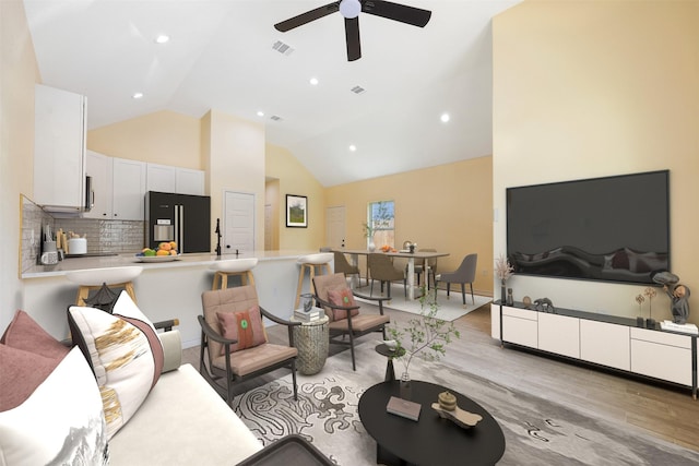 16960 W Dounreay, Montgomery, TX 77316 - living room featuring light wood-style flooring, ceiling fan, high vaulted ceiling, and recessed lighting