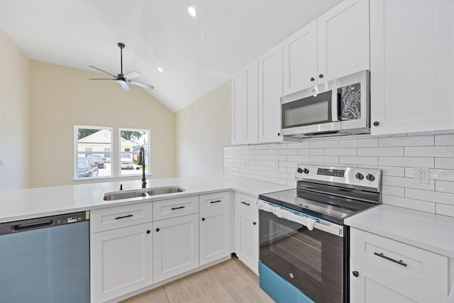 16960 W Dounreay, Montgomery, TX 77316 - kitchen featuring stainless steel appliances, ceiling fan, decorative backsplash, light countertops, and lofted ceiling